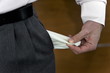 Businessman pulling out empty pocket