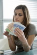 Professional woman counting euro bills