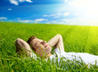 Photo: young man in grass young man in grass