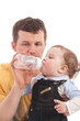 Photo: Father give drink her son by feeding bottle Father give drink her son by feeding bottle