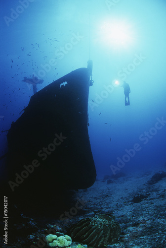 Photo: Diver exploring bow of sunken fishing trawler Diver exploring bow of sunken fishing trawler