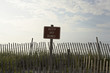 Fence and sign reading 'keep off dunes'