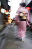 Photo: Japan, Kyoto, Pontocho-dori, Woman wearing kimono walking on narrow street, motion blur Japan, Kyoto, Pontocho-dori, Woman wearing kimono walking on narrow street, motion blur
