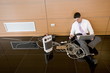 Office worker on floor with wires and laptop