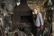 Blacksmith Standing by Forge