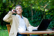 Businessman on mobile outdoor