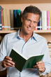 Mature man in library