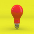 lampadina rossa su fondo giallo