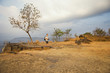 Photographer Standing at the Edge of a Cliff