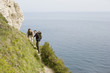 Couple Hiking on a Path Above the Water