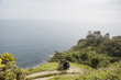 Couple Sitting on an Outlook Above the Water