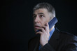 Foto: Worried Businessman on the Telephone Worried Businessman on the Telephone