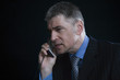 Foto: Worried Businessman on the Telephone Worried Businessman on the Telephone