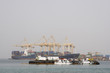 Photo: khor fakkan uae large cargo ships docked to load and unload goods at khor fakkport khor fakkan uae large cargo ships docked to load and unload goods at khor fakkport