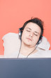 Man listening to music in bed