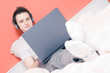 Man listening to music in bed