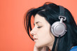 Woman listening music on headphones