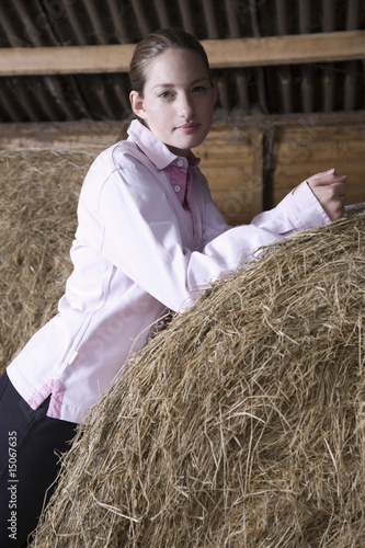 Photo: Girl relaxing in barn, portrait Girl relaxing in barn, portrait