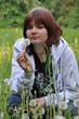 a young woman with dandelion clock a young woman with dandelion clock