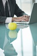 Businessman with apple at laptop