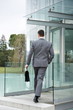Businessman entering office building