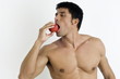Photo: Fit young man biting an apple Fit young man biting an apple
