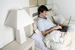 Young man in bed with laptop computer