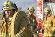 Firefighter carrying hose