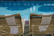 Sunloungers by swimming pool