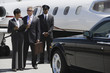 Photo: Mid-adult businesswoman, senior businessman and chauffeur in front of private airplane. Mid-adult businesswoman, senior businessman and chauffeur in front of private airplane.