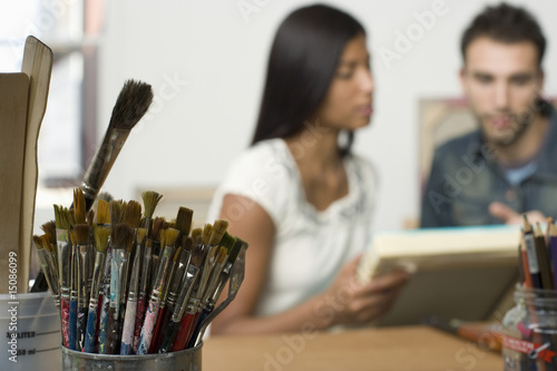 Photo: paint brushes on artist's work table paint brushes on artist's work table