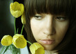 Young charming woman with bouquet of tulips