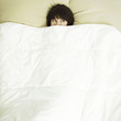 Young beautiful woman in bed