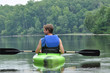 Young Man Kayaking Away