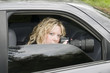 undercover secret agent woman spying with camera in dark car undercover secret agent woman spying with camera in dark car