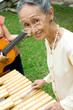 senior woman playing traditional music senior woman playing traditional music