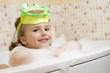 Cute girl playing in foam Cute girl playing in foam