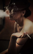 fashion style photo of a gorgeous brunette holding a cigarette