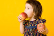 Foto: Little girl with two apple Little girl with two apple