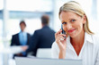 A business woman talking using a mobile phone
