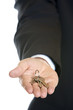 businessman's hand holding key to success