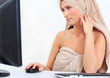 towel pampered woman working on computer