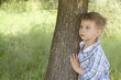 care for nature - little boy embrace a tree