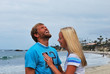 A happy laughing couple on the beach