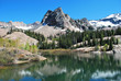A beautiful mountain lake with a tall peak in the background