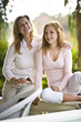 Photo: Portrait of mother and daughter relaxing outdoors on terrace Portrait of mother and daughter relaxing outdoors on terrace