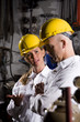 Two co-workers in office maintenance room