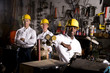 Multi-ethnic coworkers in office maintenance area