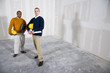 Multi-ethnic men in office space ready for buildout