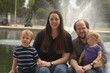 Family of 4 with fountain behind